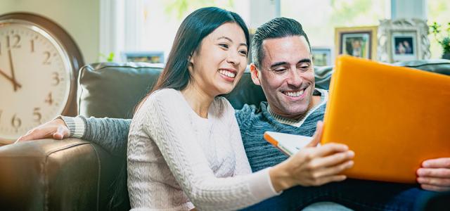 Couple watching laptop